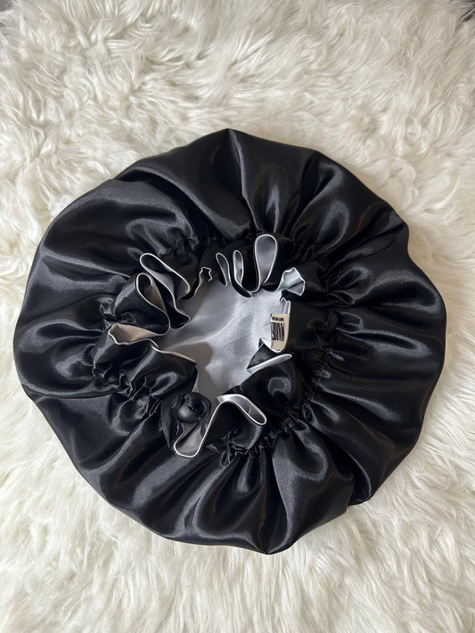 Handmade reversible satin bonnet in black and silver with an adjustable clasp for custom fit by mariebeauteeco