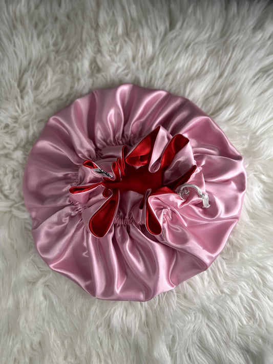 Handmade reversible satin bonnet in red and pink with an adjustable clasp for custom fit by mariebeauteeco