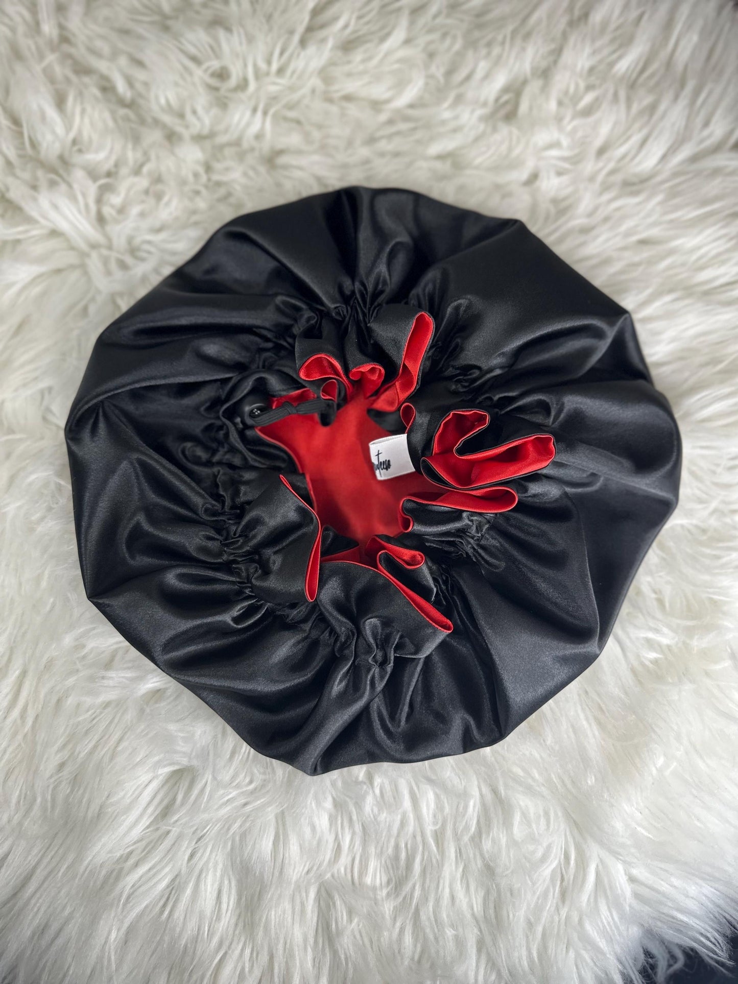 Handmade reversible satin bonnet in black and red with an adjustable clasp for custom fit by mariebeauteeco