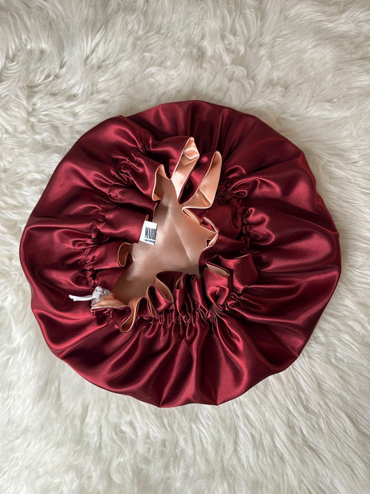 Handmade reversible satin bonnet in burgundy and peach with an adjustable clasp for custom fit by mariebeauteeco