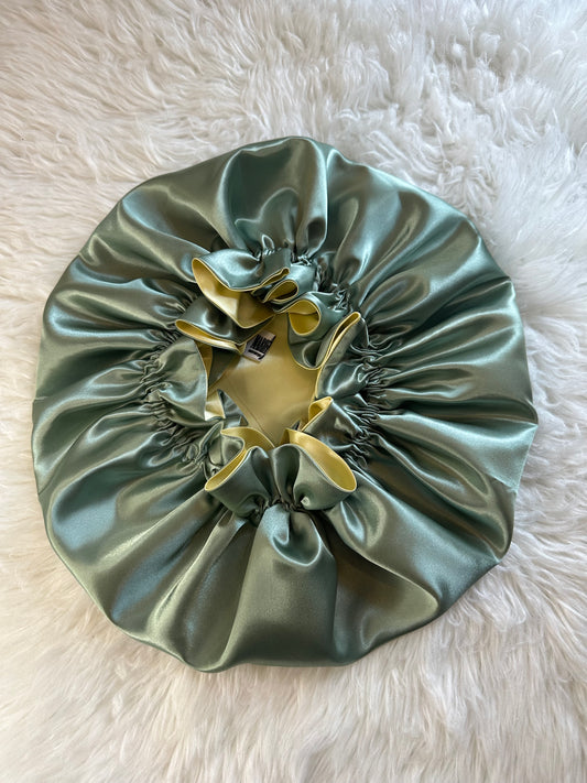 Handmade reversible satin bonnet in green and yellow with an adjustable clasp for custom fit by mariebeauteeco