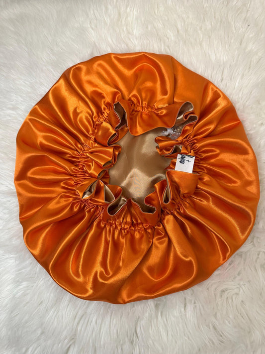 Handmade reversible satin bonnet in orange and gold with an adjustable clasp for custom fit by mariebeauteeco