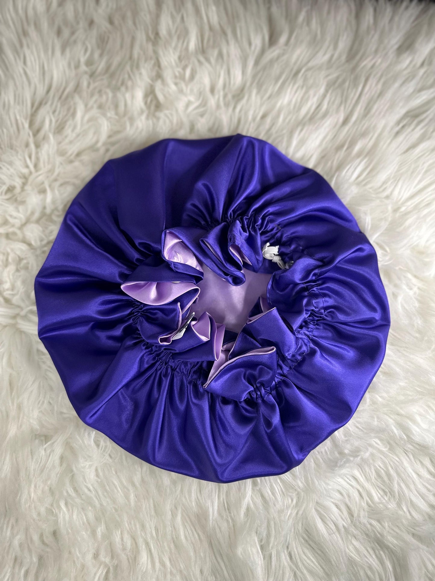 Handmade reversible satin bonnet in purple and lavender with an adjustable clasp for custom fit by mariebeauteeco