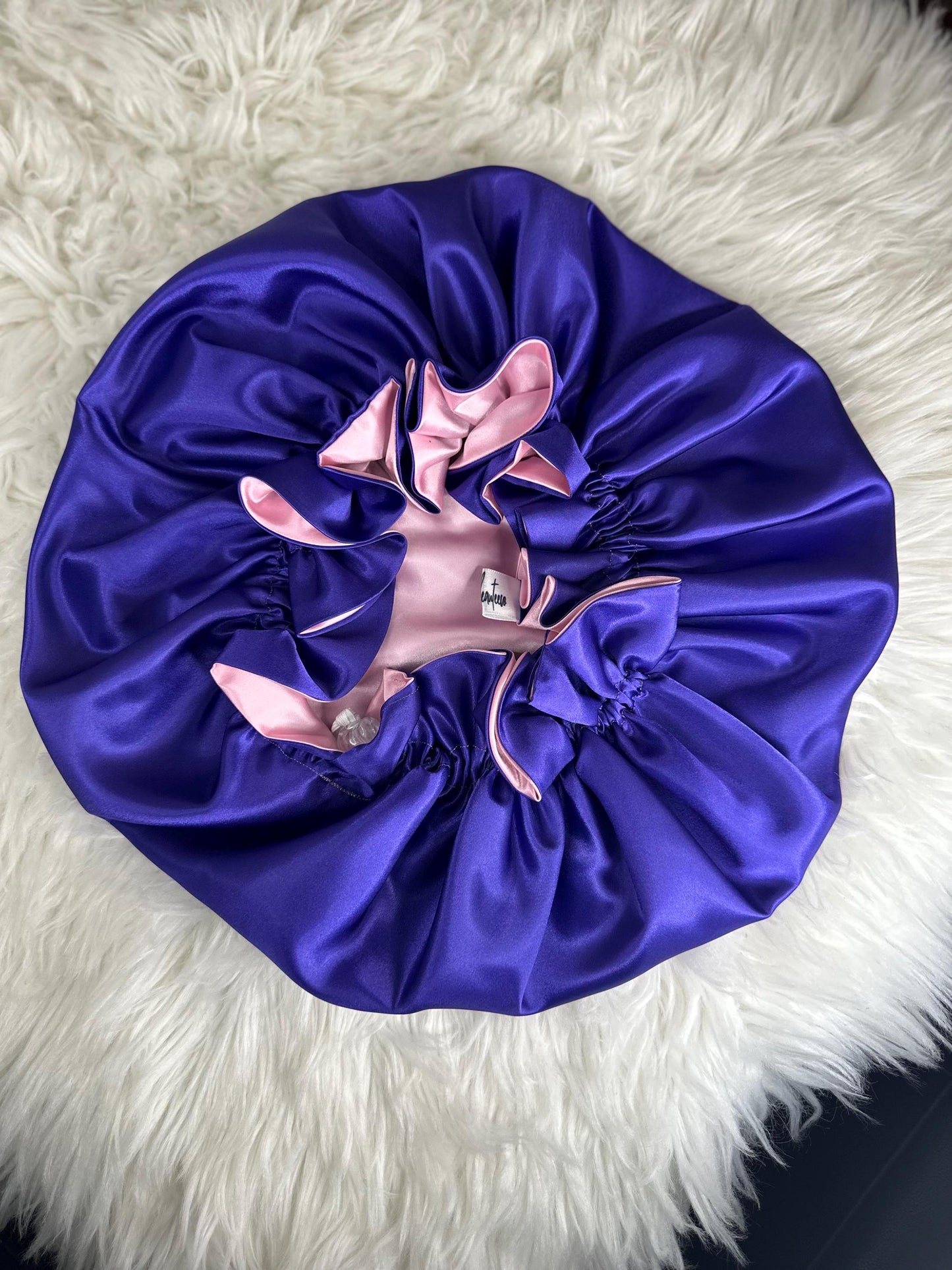 Handmade reversible satin bonnet in purple and pink with an adjustable clasp for custom fit by mariebeauteeco