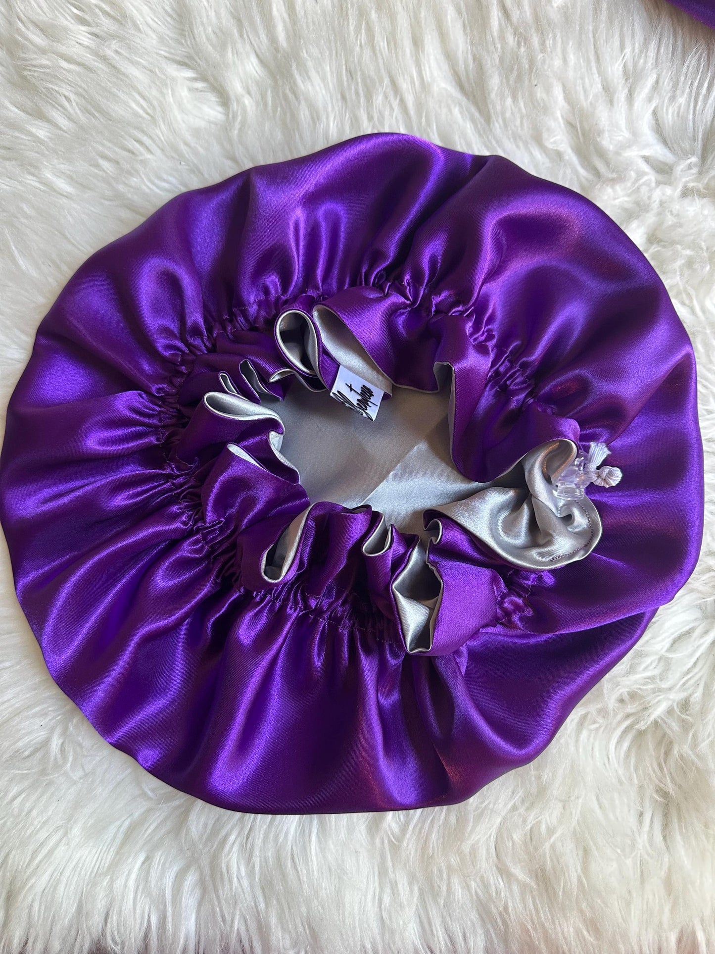 Handmade reversible satin bonnet in purple and silver with an adjustable clasp for custom fit by mariebeauteeco