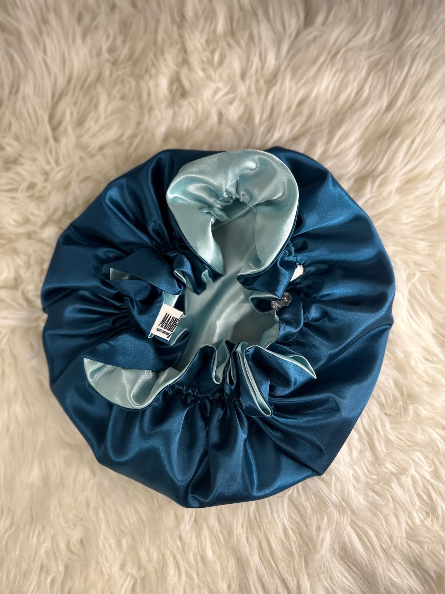 Handmade reversible satin bonnet in teal and seafoam with an adjustable clasp for custom fit by mariebeauteeco